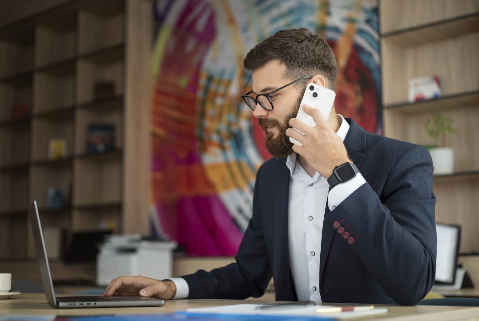 side-view-man-with-smartphone-laptop